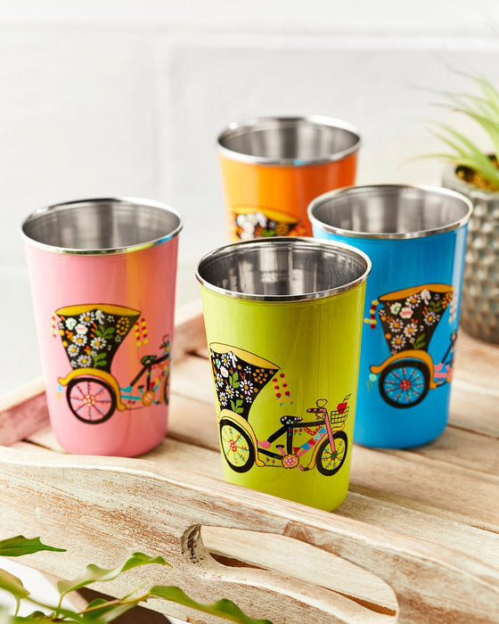 Set of colourful stainless steel tumblers with bicycle designs on a wooden tray.