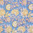 A sectiion of the Aasmani hand-block-printed cotton tablecloth with pink and yellow botanicals on a dusty blue background