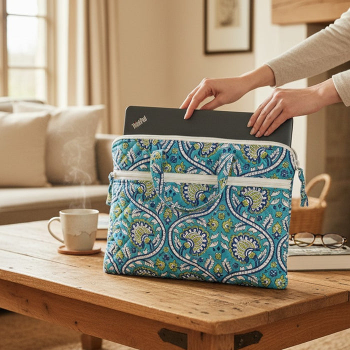 Turquoise and Lime Floral Design Block Printed Laptop Bag showing a laptop sliding into the bag 