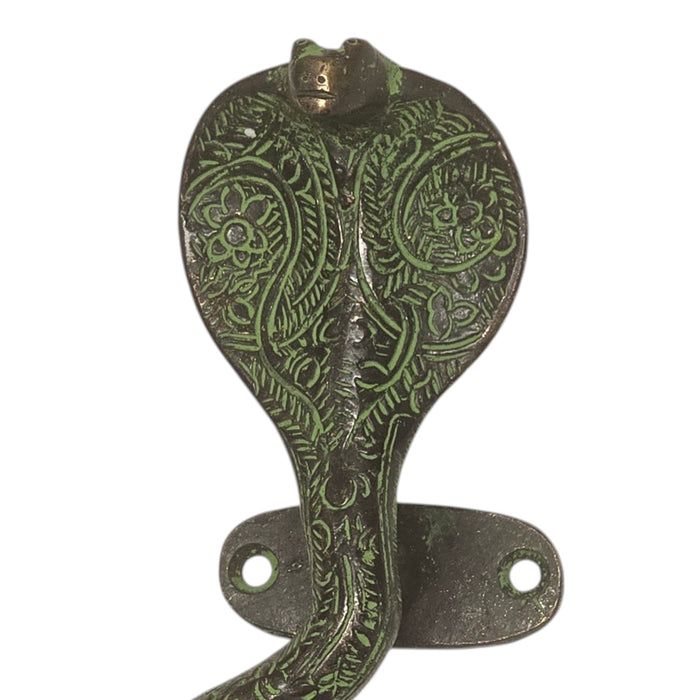 Cobra Design Green Patina Brass Handle close up shot set against a white backgrund