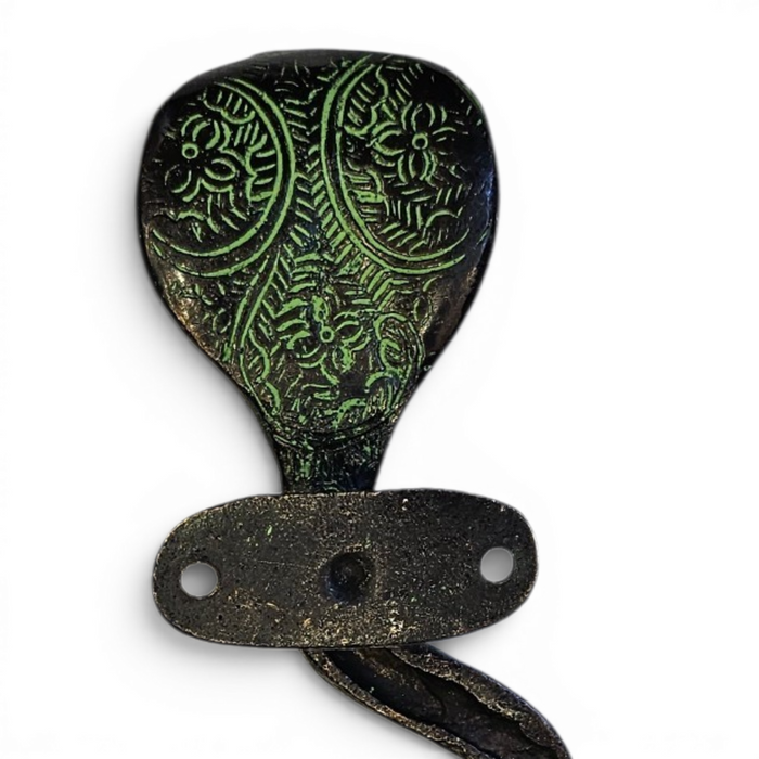 Reverse Side picture of the hooded head of a Cobra Design Green Patina Brass Handle on a white background