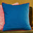 Blue cotton canvas cushion cover with pink pom-pom trim and zip closure.  45x45cm.