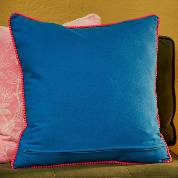 Blue cotton canvas cushion cover with pink pom-pom trim and zip closure.  45x45cm.
