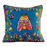 Decorative pillow with embroidered butterfly design on a couch