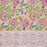 Top-down view of a Crimson Anar Sanganeri hand-block printed cotton tablecloth featuring a wide terracotta red floral border and a warm sand-colored background