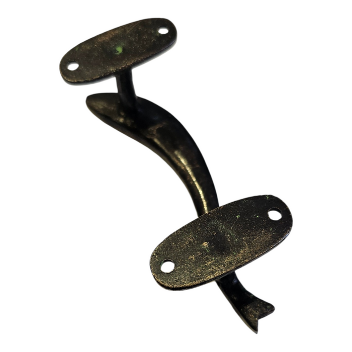 The reverse side of a Curved Fish Design Green Patina Brass Handle on a white background