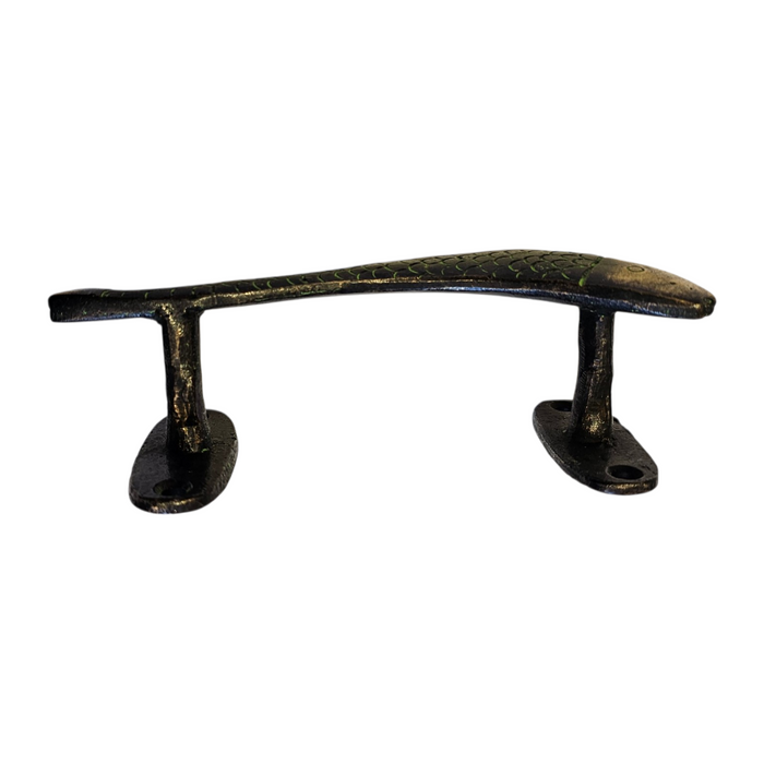 Decorative metal handle with a curved fish design on a white background