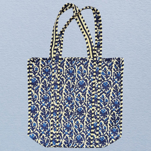 Tote bag with blue floral pattern on a light blue background