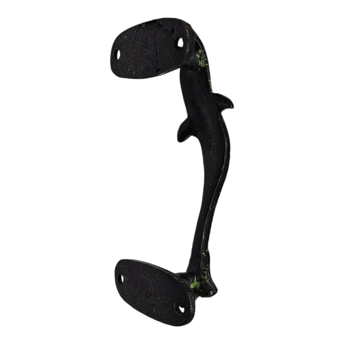 Reverse side of a Dolphin Design Green Patina Brass Handle on a white background.