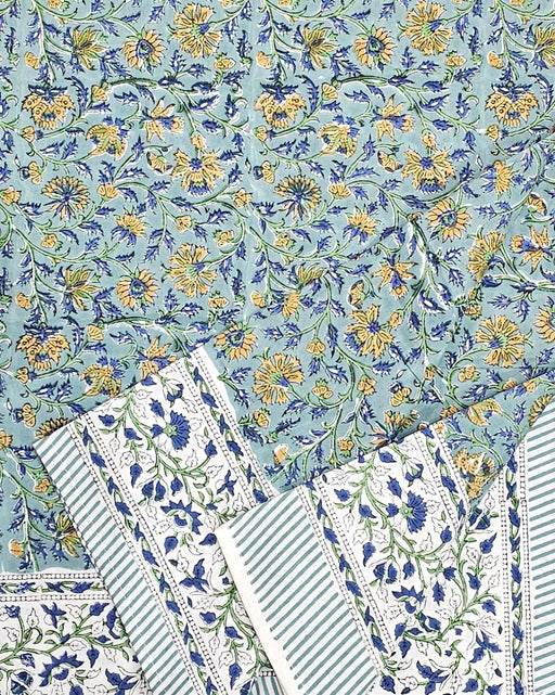 Green Block Print Tablecloth with a Yellow and Blue Floral Motil with the sides folded up