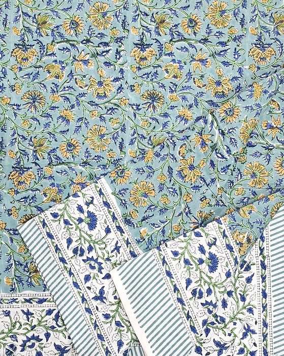 Green Block Print Tablecloth with a Yellow and Blue Floral Motil with the sides folded up