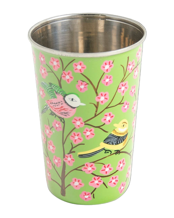 Stainless steel tumbler with bird and floral design on a green background