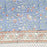 Blue block printed cotton tablecloth with a green and orange floral design.