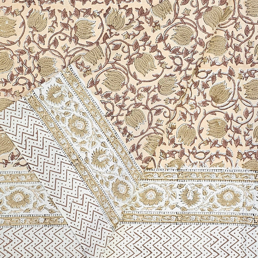 Hand Block Printed Cotton Tablecloth with scrolling vines and Tulip design in a soft brown colour palette.  Folded back to show the border design.