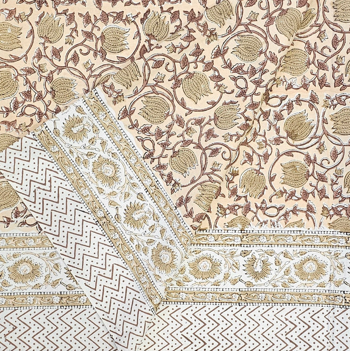 Hand Block Printed Cotton Tablecloth with scrolling vines and Tulip design in a soft brown colour palette.  Folded back to show the border design.