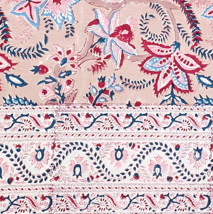 Block printed tablecloth featuring a layered border