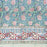 Floral patterned fabric with red and white flowers on a green background