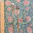 Block printed pomegranite design cotton tablecloth shown with a knife and fork with a ruler to show the scale of the pattern.
