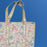 Indian Palm Quilted Cotton Tote Bag Handle against a plain blue background