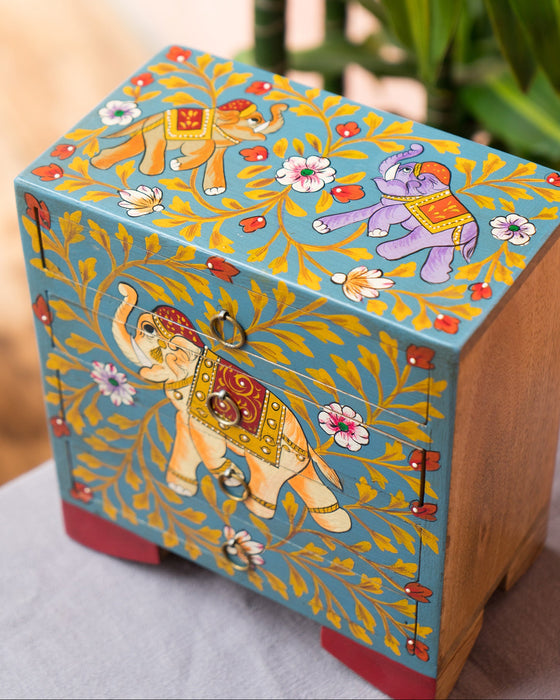 Decorative box with colorful elephant design on a light background