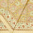 Golden turmeric hand-block printed cotton tablecloth with terracotta floral vines and sage green accents shown folded.