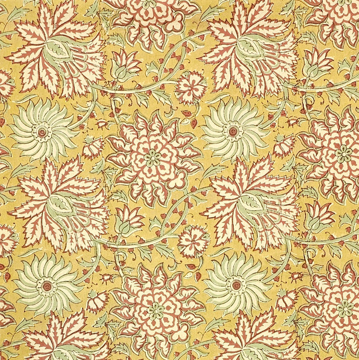 Golden turmeric hand-block printed cotton tablecloth with terracotta floral vines and sage green accents.