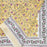 Folded Marigold Jaal design tablecloth with an intricate floral pattern on a yellow background