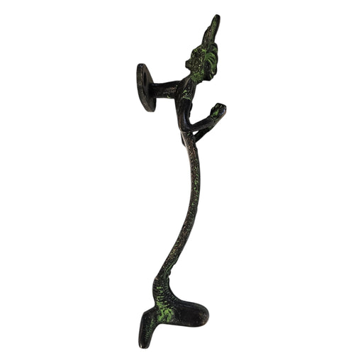 Side view of a Namaste Figure Green Patina Brass Handle on a white background