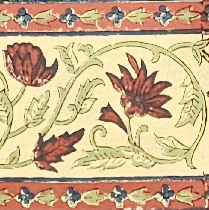 Dusky indigo slate hand-block printed cotton tablecloth with Terracotta-rust, warm peach-cream, and soft sage-celadon botanicals.  Close up of the border.