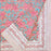 Floral-patterned pink lily tablecloth folded
