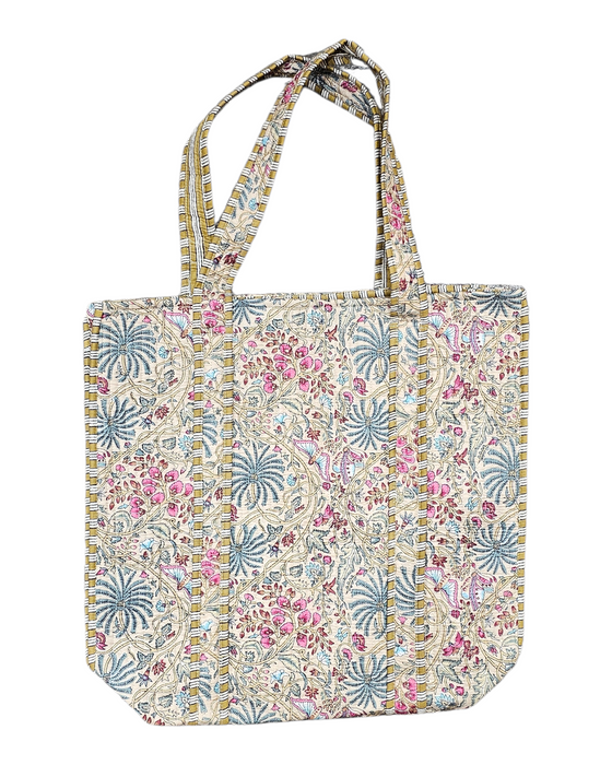 Floral-patterned tote bag on a beige background