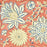 Terracotta rust and slate blue hand-block printed botanical themed cotton tablecloth close up shot.