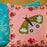 Decorative pillow with a butterfly design on a pink background