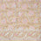 Block printed tablecloth with a pink and white floral design on a beige background