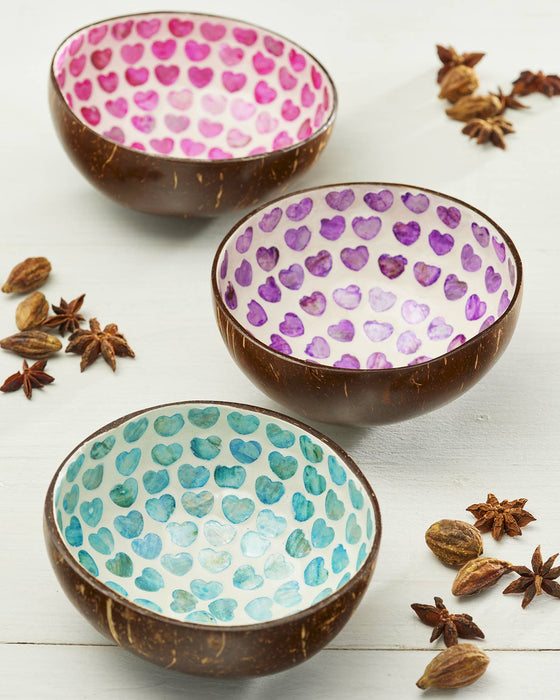 Three coconut bowls with heart patterns