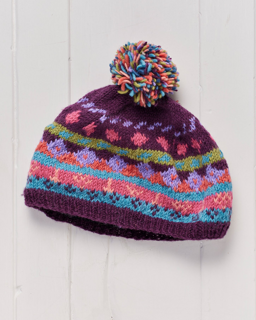A hand knitted and fleece lined Shivalaya Pompom Beanie Hat.