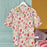 Shvanthi Block Print Short Pyjamas on a hanger against a colourful background