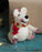 A white Felt Polar Bear wearing a Knitted Scarf Christmas Decoration