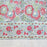 Handcrafted 100% cotton tablecloth in Slate Garden print, showing crimson red flowers, sage green leaves on a blue-grey background, and matching striped hem detail.