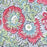 Detailed image of the Handcrafted 100% cotton tablecloth in Slate Garden print, showing crimson red flowers, sage green leaves on a blue-grey background.