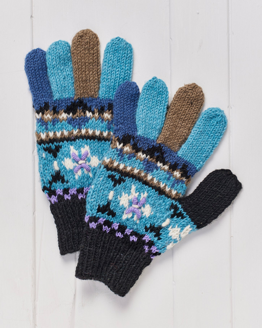 A pair of hand knitted Snowflake Finger Gloves.