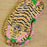 Eyemask with tiger pattern on a wooden surface