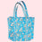 blue floral cotton quilted tote bag on a soft pink background