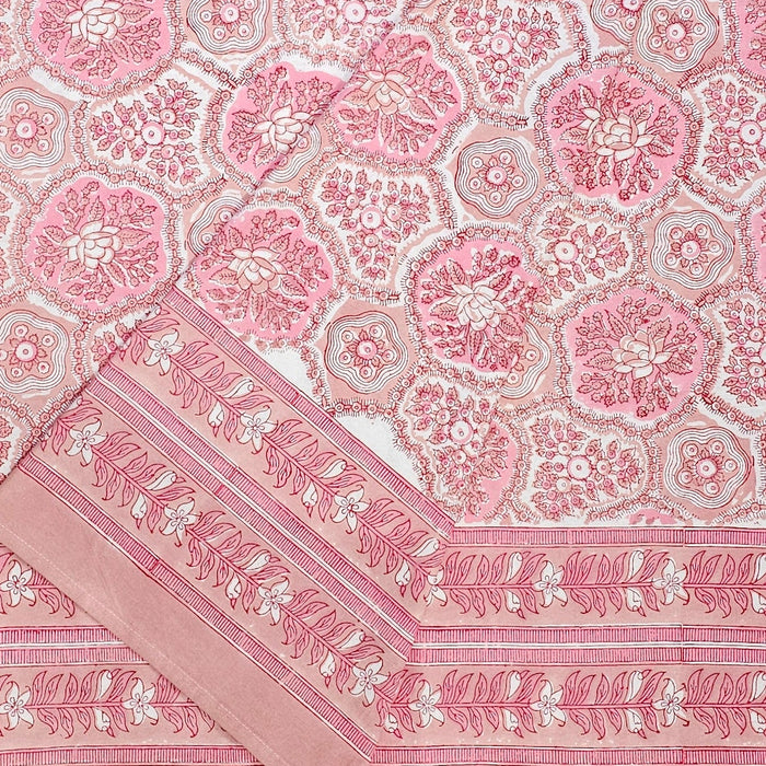 Pink and white patterned fabric with decorative border