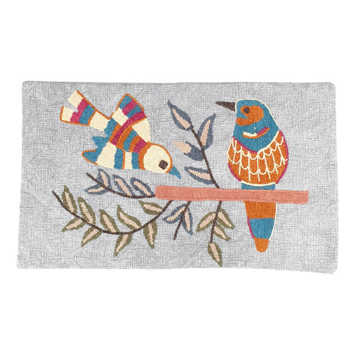 Two embroidered birds on a cushion cover